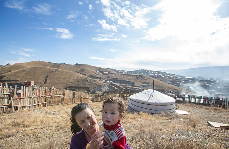 Mongolia gallery: Nandin Tungalag, with her nephew Munkherdene Amarsanaa aged 1, near their h