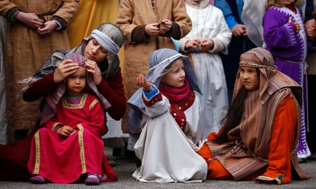 Children take part in a re-enactment during Good Friday in Bensheim, Germany.