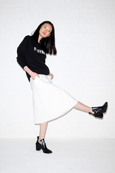 All Ages monochrome: black sweatshirt with slogan white skirt black boots