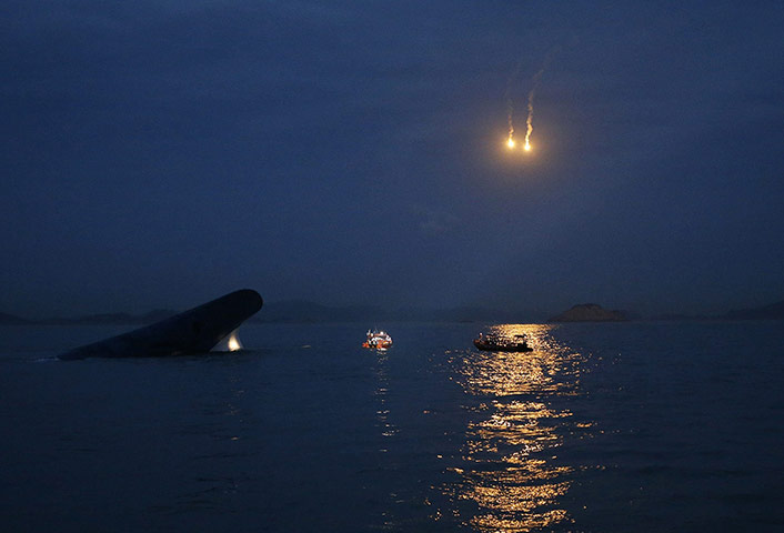 20 Photos: South Korean ferry 'Sewol' is seen sinking at the sea off Jindo