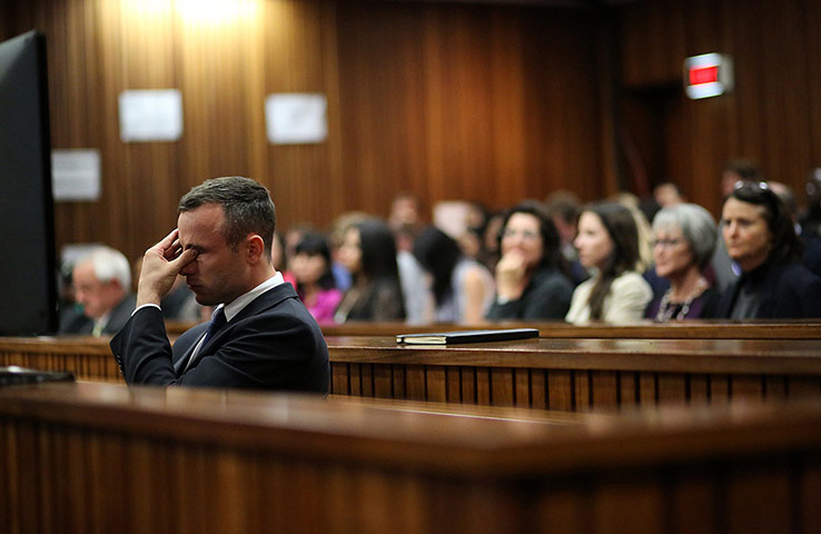 20 Photos: Oscar Pistorius rubs his eyes in court in Pretoria