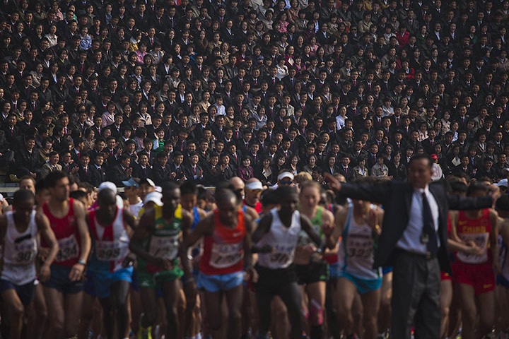 20 Photos: Spectators watch from the stands of the Kim Il Sung Stadium