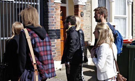 Buyers gather yesterday outside a flat in Forest Gate, east London.