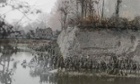 Soldiers stand at the ramparts in Ypres, Belgium, 1917 and the same location in 2013