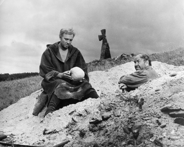 A scene from a film version of 'hamlet' directed by grigori kozintsev and starring innokenti smoktunovsky, the score was composed by dimitry shostakovich, hamlet with yorick's skull.