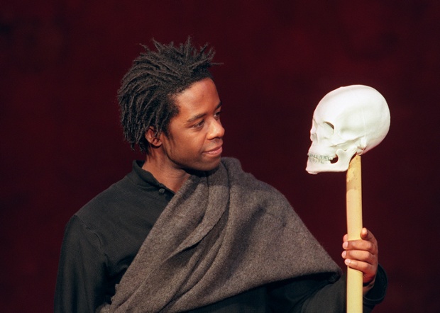actor Adrian Lester playing the role of Hamlet rehearses a scene of William Shakespeare's tragedy 