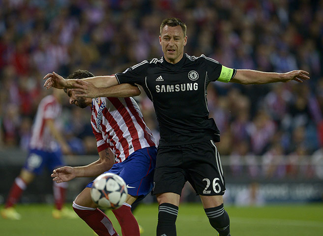 Atletico v chelsea: Atletico Madrid's Raul Garcia and Chelsea's John Terry