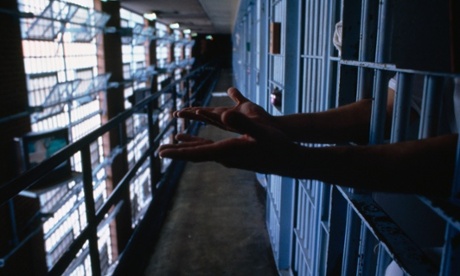 prison bars hands