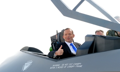 Prime minister Tony Abbott tries out the cockpit of the F-35 fighter plane in Canberra.
