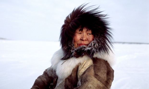 Nadiya Asyandu, a Nganasan woman, wramly dressed while travelling on the frozen Kheta River in the winter. Taymyr, Northern Siberia, Russia. 2004