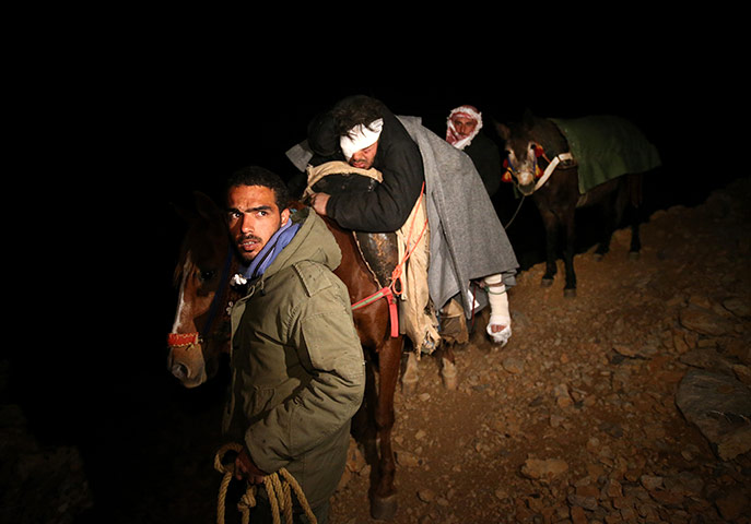 20 Photos: Saleh Zawaraa is carried on horseback after being severely injured in Syria