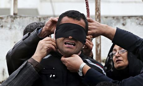 Samereh Alinejad and her husband Abdolghani remove the noose from Balal.