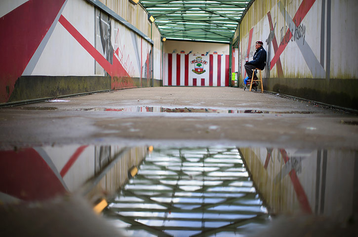 saturday roundup:  A veteran sits with a collection pot for the 'Help For Heroes' charity