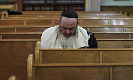 A Jewish man attends the morning prayer at a synagogue in Donetsk, Ukraine. Photograph: Baz Ratner/Reuters