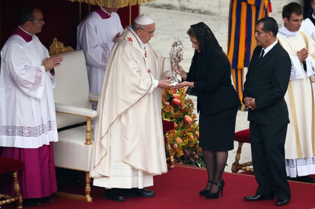 Floribeth Mora from Costa Rica, who claims she was cured of a serious brain condition by a miracle attributed to late Pope John Paul II, presents his relic to Pope Francis.
