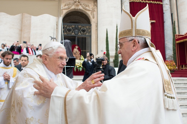 Pope Francis embraces his predecessor Pope Emeritus Benedict XVI.