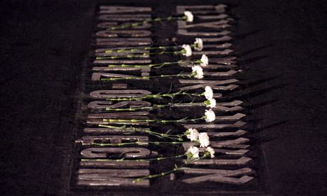 Auschwitz plaque with flowers in Yad Vashem Holocaust memorial on Holocaust Remembrance Day