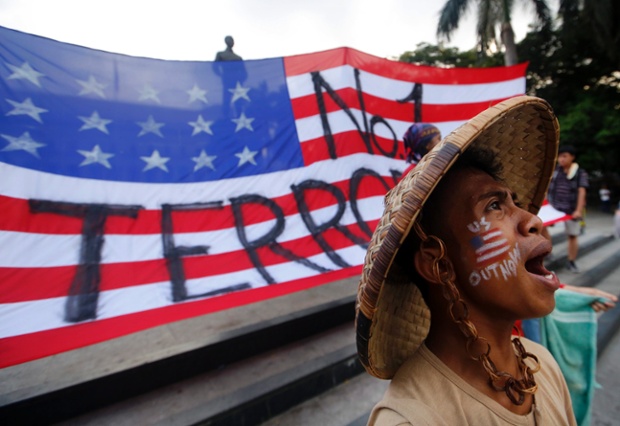 A protester shouts anti-US slogans during a protest rally against President Barack Obama's visit in Manila, Philippines.