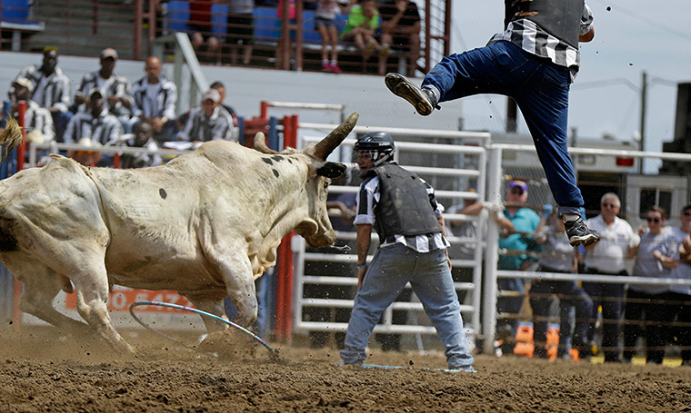 FTA: Angola Prison Rodeo: A prisoner is thrown into the air by a bull