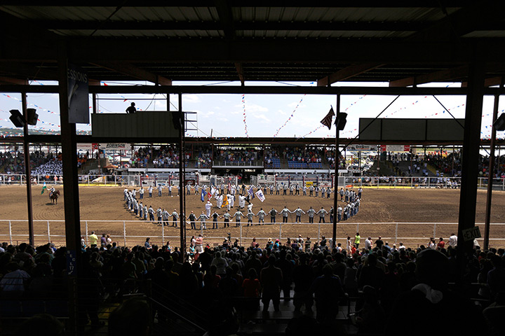 FTA: Angola Prison Rodeo: Prisoners hold hands and form a circle to pray inside the ring before the s