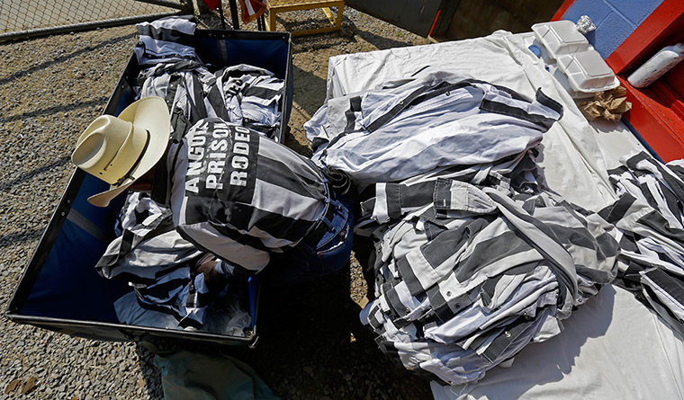 FTA: Angola Prison Rodeo: An inmate prepares clothes for participants