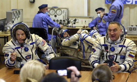 US astronaut Steven Swanson, left, and Russian cosmonaut Alexander Skvortsov prepare for their launch to the International Space Station last month.