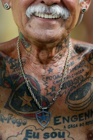 A fan of Brazil's Botafogo shows off his tattoos before the Copa Libertadores match in Rio de Janeiro, Brazil.