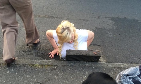 Ella Birchenough being rescued by firefighters after getting stuck in a storm drain while trying to retrieve her mobile phone.