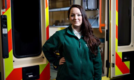 Ashley Jane Strawbridge in paramedic uniform in front of an ambulance