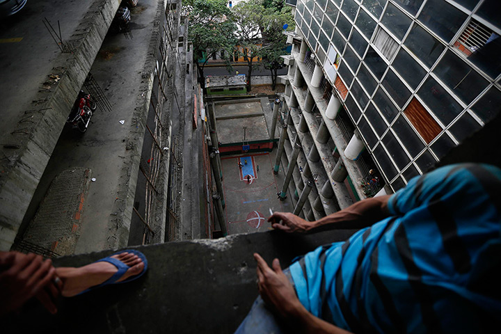 Tower of David: Men sit and look down at a basketball court
