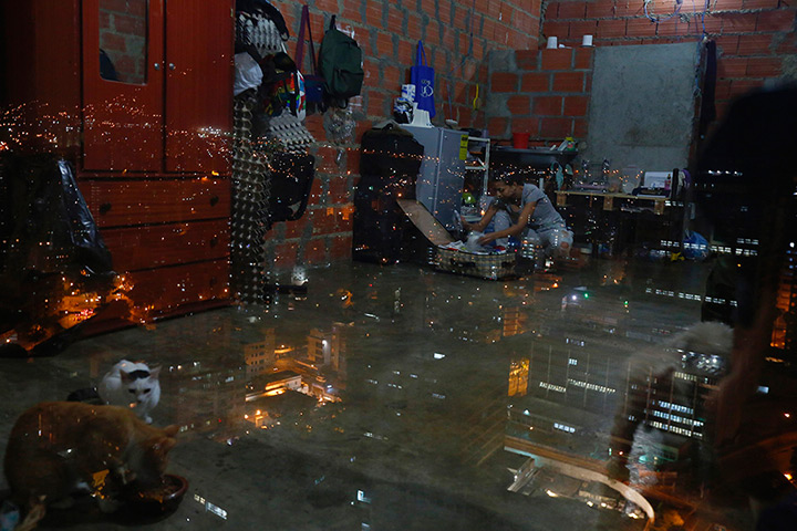 Tower of David: A woman packs as she prepare to leave her apartment after living in the sky