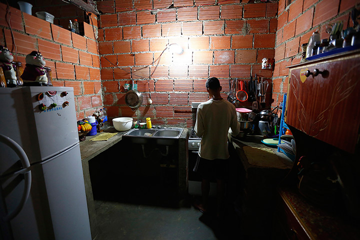 Tower of David: A man cooks in his apartment 