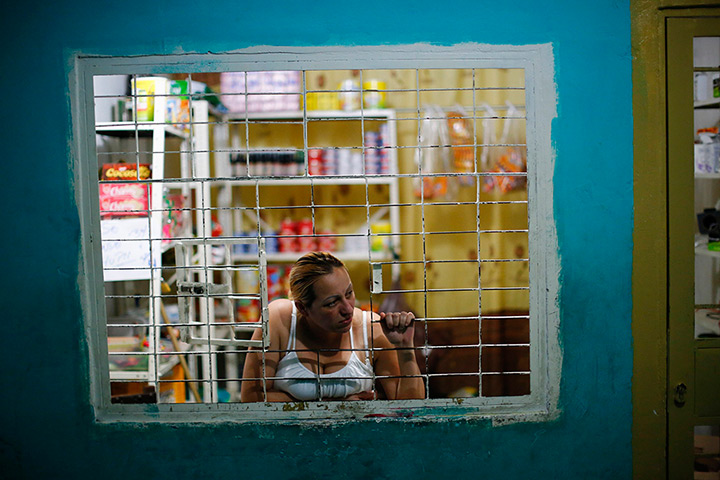 Tower of David: A woman looks out of a window at her shop in a corridor in the skyscraper