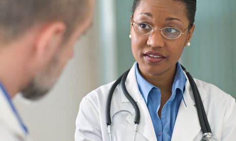 Concerned woman doctor listening to patient