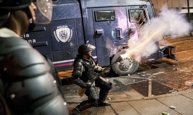 Members of the National Bolivarian Police (PNB) fire at demonstrators during a protest against the government of Venezuela's president Nicolas Maduro at Chacao sector in Caracas, Venezuela.