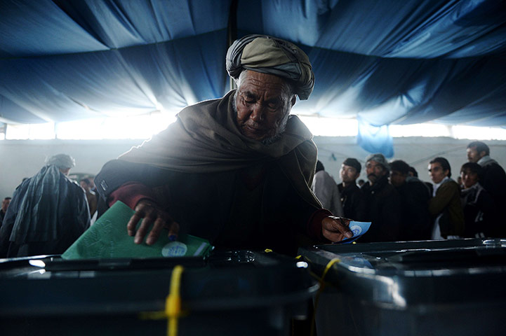 Afghan: An Afghan man casts his vote