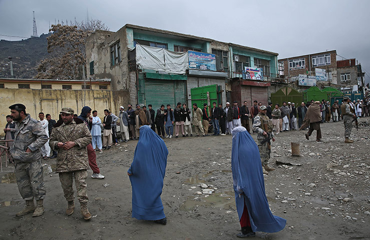 Afghan: Men line up for the registration process in Kabul