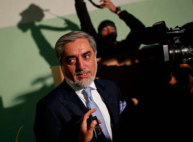 Afghan: Presidential candidate Abdullah Abdullah speaks to the media after voting 