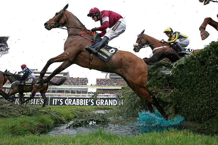 aintree day 3: Quito De La Roque smashes through the Water Jump