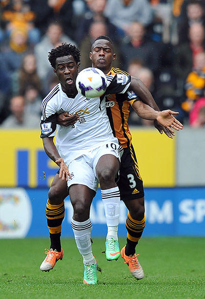 Saturday Roundup: Wilfried Bony shields the ball from Maynor Figueroa