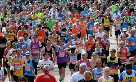 Competitors head to the finish line during the 2012 London Marathon in London.