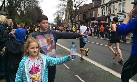 Louis and Grace Mitchell hand out water to Sheffield runners