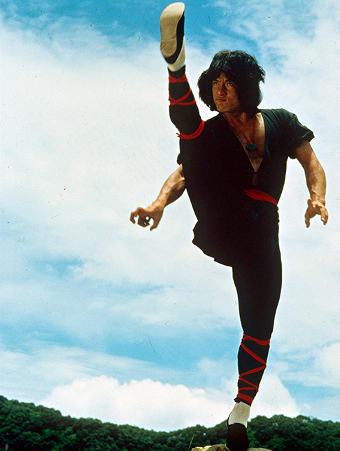 Jackie Chan performs a high kick in a publicity still for the 1982 film Dragon Lord