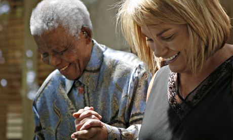 Zelda la Grange walks hand-in-hand with Nelson Mandela in Johannesburg in 2007.
