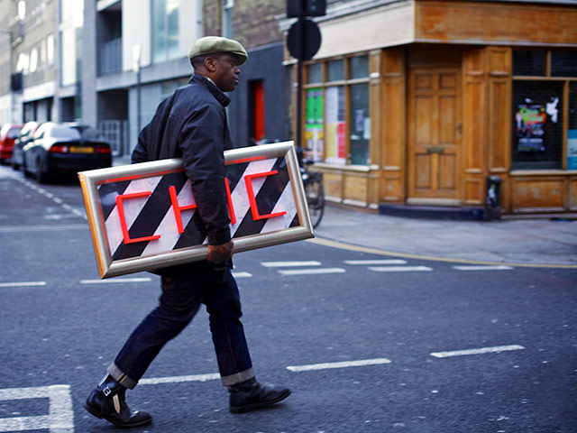In pictures: Chic: man holding chic sign