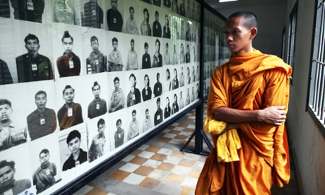 A Cambodian looks at photos of victims on display at the Toul Sleng Genocide museum.
