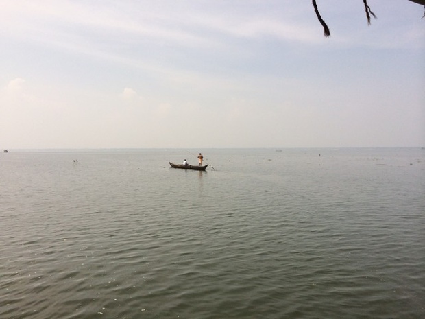 'A couple of local fishermen heading out for their daily catch.'