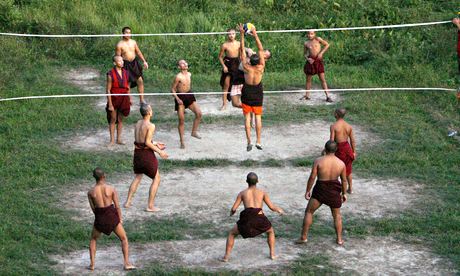 Monks play volleyball at Rabdey Dratsang in the southeastern district of Samdrup Jongkhar in Bhutan