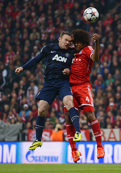 Bayern v United: Wayne Rooney and Dante clash heads