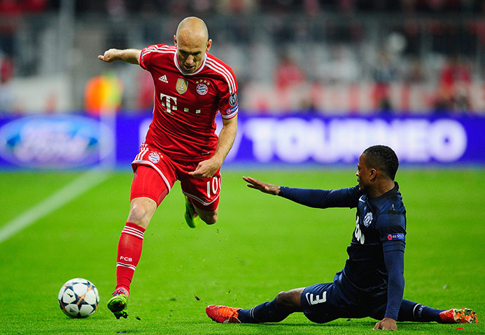 Bayern v United: A sliding Patrice Evra stops the fleet-footed Arjen Robben